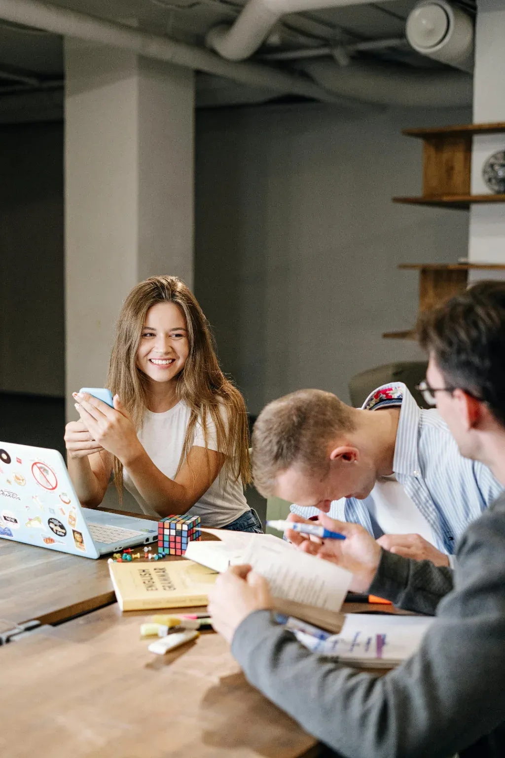An agency team collaborating in a small office