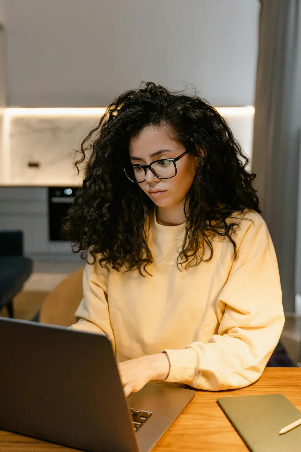 An editorial team reviewing content on a laptop